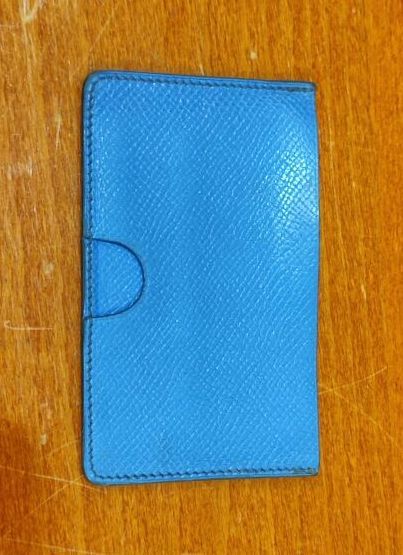 HERMES
Set of small leather goods including...
