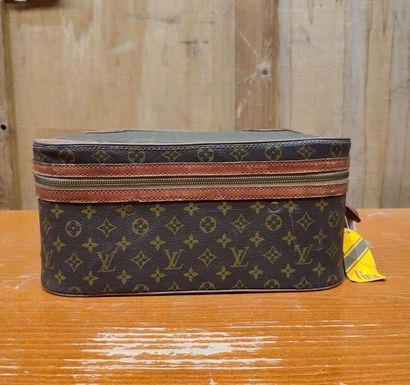 LOUIS VUITTON
Set of three small travel bags:...