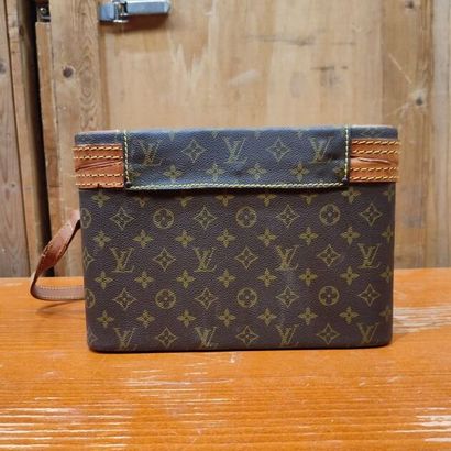 LOUIS VUITTON
Set of three small travel bags:...