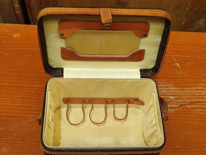 LOUIS VUITTON
Set of three small travel bags:...