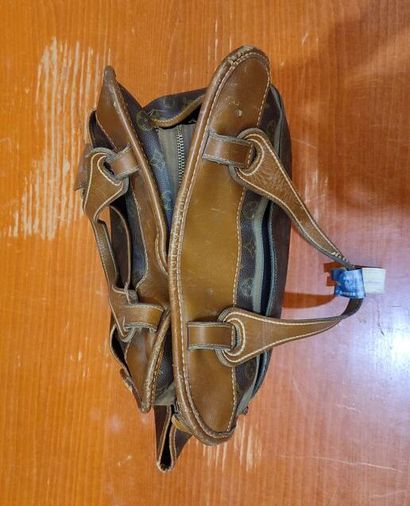 LOUIS VUITTON
Set of three small travel bags:...