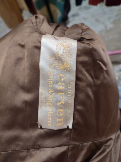CARVEN
Slim-fitting, mid-length brown fur...