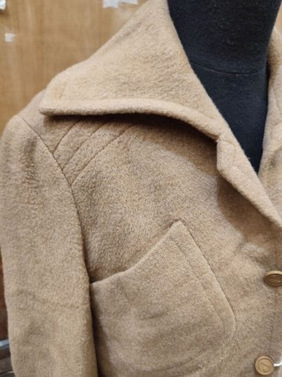 CARVEN
Beige ensemble with belted jacket,...