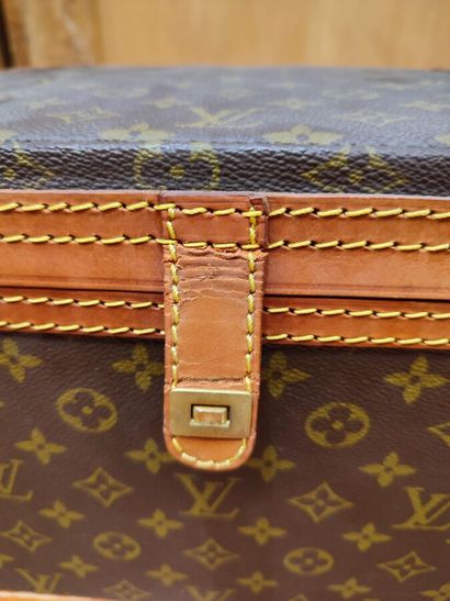 LOUIS VUITTON
Set of three small travel bags:...