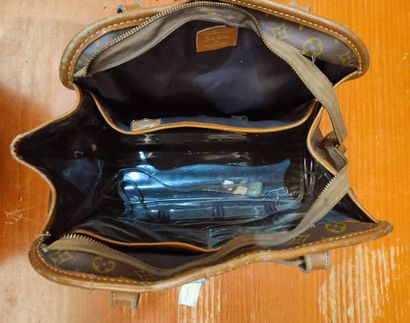 LOUIS VUITTON
Set of three small travel bags:...