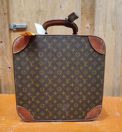 LOUIS VUITTON
Set of three small travel bags:...