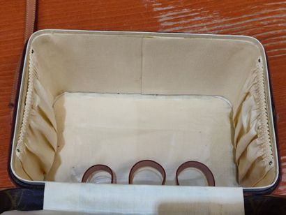 LOUIS VUITTON
Set of three small travel bags:...