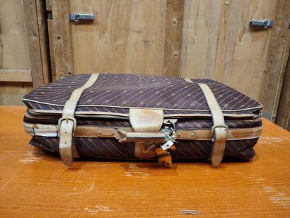 GUCCI
Set of two suitcases in monogrammed...