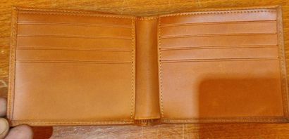 HERMES
Set of small leather goods including...