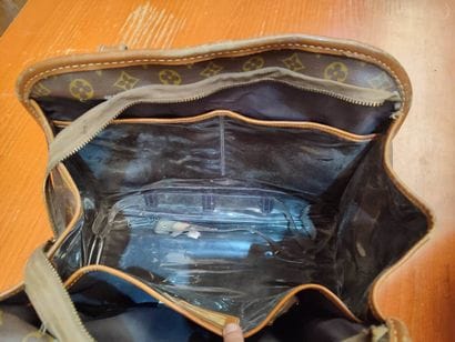 LOUIS VUITTON
Set of three small travel bags:...