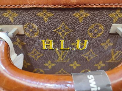 LOUIS VUITTON
Set of three small travel bags:...