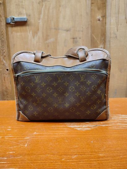 LOUIS VUITTON
Set of three small travel bags:...