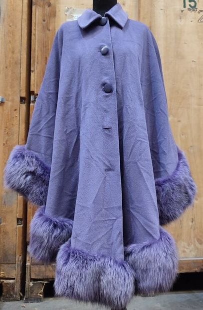 CARVEN
Purple cape with fur bottom in the...