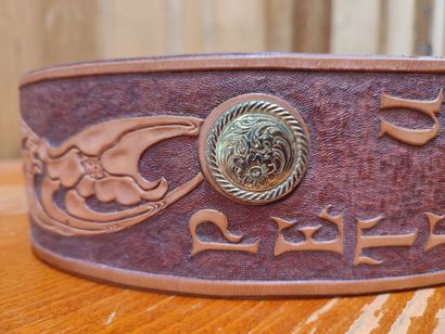 Leather belt with floral decoration and 