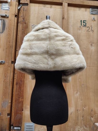 CARVEN
Mid-length, belted coat in cream astrakhan...