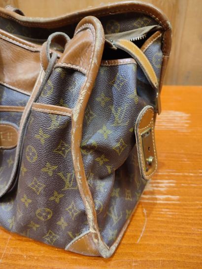 LOUIS VUITTON
Set of three small travel bags:...