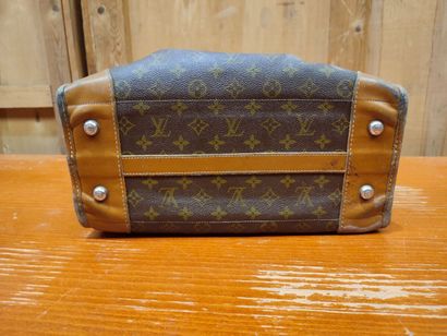 LOUIS VUITTON
Set of three small travel bags:...