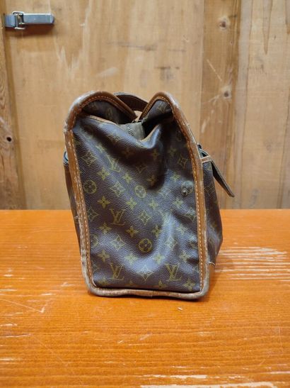 LOUIS VUITTON
Set of three small travel bags:...