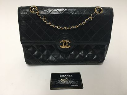 CHANEL 
Black quilted leather bag 
Height...