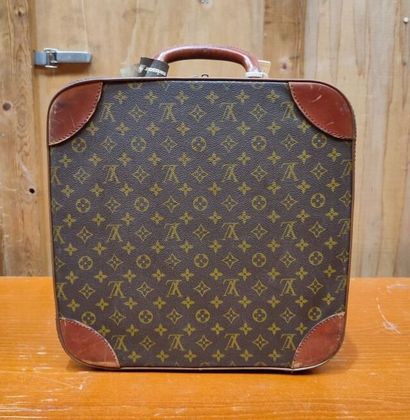 LOUIS VUITTON
Set of three small travel bags:...