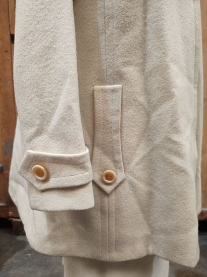 CARVEN
Cream wool ensemble with long jacket,...