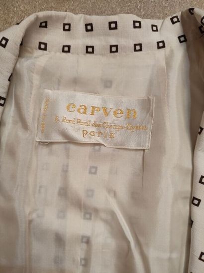 CARVEN
Outfit in cream fabric patterned with...
