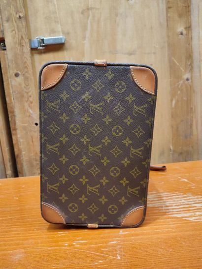 LOUIS VUITTON
Set of three small travel bags:...
