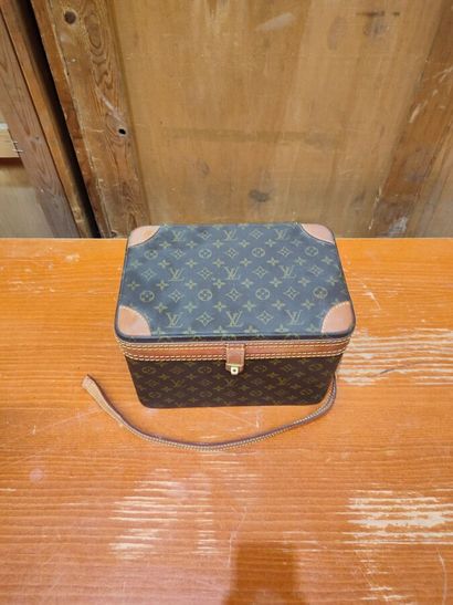 LOUIS VUITTON
Set of three small travel bags:...