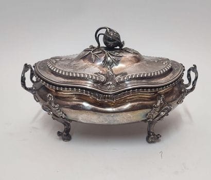 A silver oval soup tureen, the handles and...