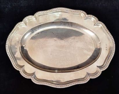 Two oval silver dishes with contours underlined...