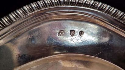 Two oval silver dishes with contours underlined...