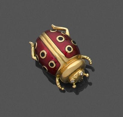 Brooch in 750 thousandths yellow gold featuring...