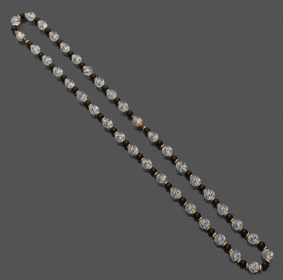 Long necklace and bracelet adorned with rock...