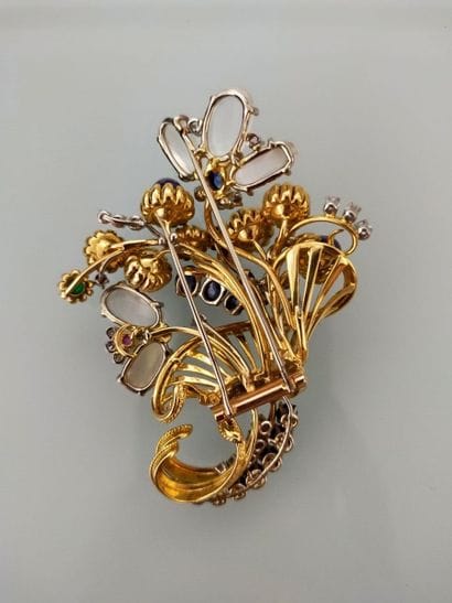 GUBLIN
Lapel clip in 750 thousandths gold...