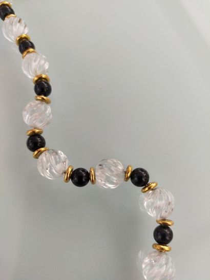 Long necklace and bracelet adorned with rock...