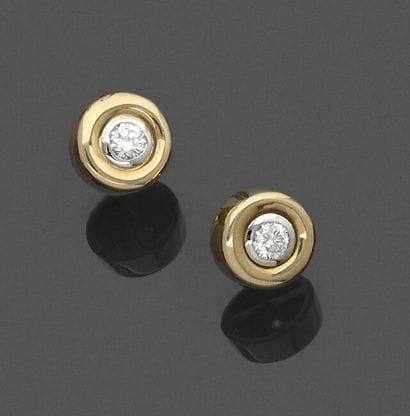 Pair of yellow gold stud earrings set with...