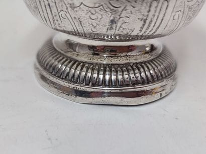 A silver tulip-shaped kettledrum decorated...