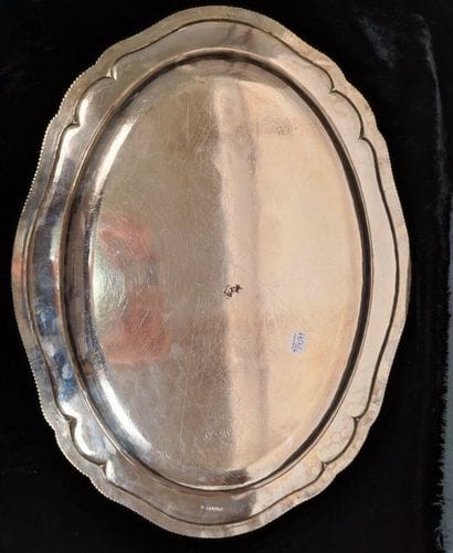 Two oval silver dishes with contours underlined...