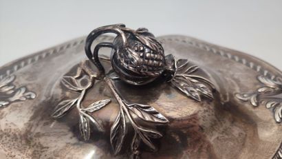 A silver oval soup tureen, the handles and...