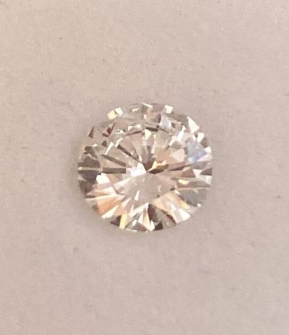 Round brilliant-cut diamond on paper.
Accompanied...