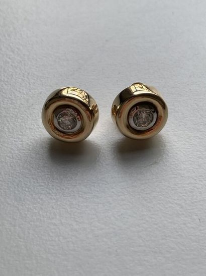 Pair of yellow gold stud earrings set with...