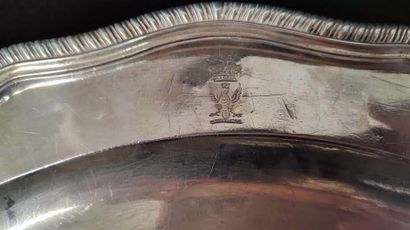 Two oval silver dishes with contours underlined...