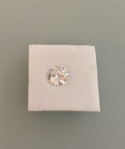 Round brilliant-cut diamond on paper.
Accompanied...