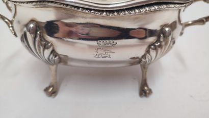 A quadripod sugar bowl with handles in silver...