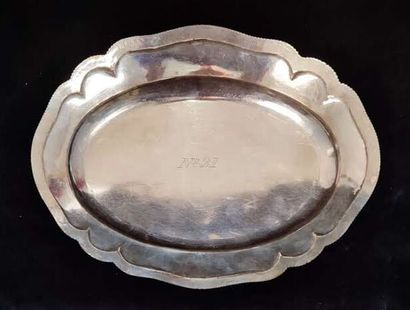 Two oval silver dishes with contours underlined...