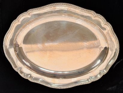 Two oval silver dishes with contours underlined...