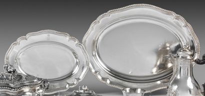 Two oval silver dishes with contours underlined...