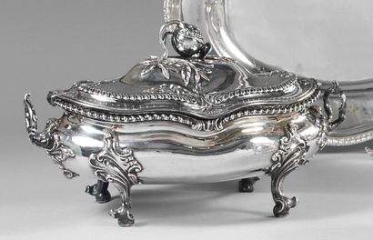 A silver oval soup tureen, the handles and...