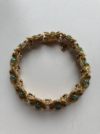 Articulated bracelet in engraved and diamond-patterned...