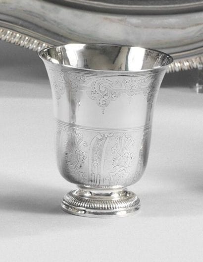 A silver tulip-shaped kettledrum decorated...